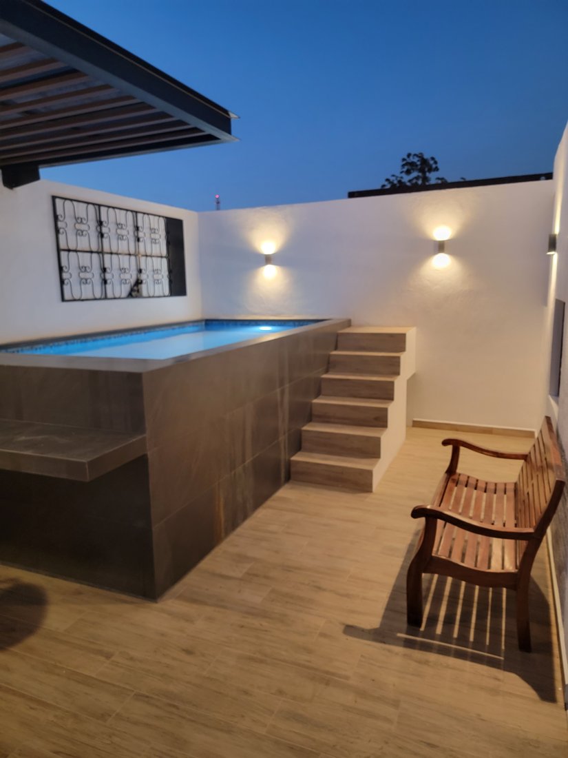 Rooftop plunge pool at dusk